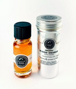 Clear glass bottle of Certified Organic Blood Orange Essential Oil